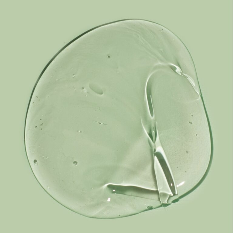 a transparent gel on a green surface